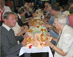 A second table full of street party goers