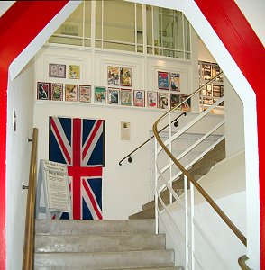 a large Union Jack and a whole range of government war time propaganda posters 
