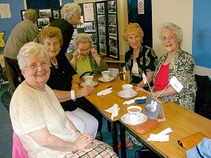 Kath takes her seat with Marj Hill, Doris and (to the right) Mavis and Flora.