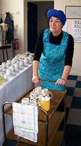 the office tea lady, complete with scarf and fag