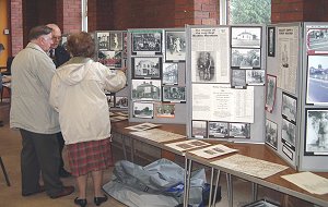 Reg Aston, who is discussing some of his display with guests