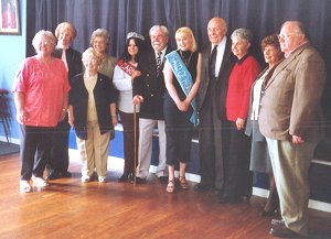 Carnival queens, attendants and members of the club committee.