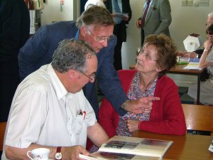 Arthur Weston makes a point to Margaret Weston and Ned Williams.