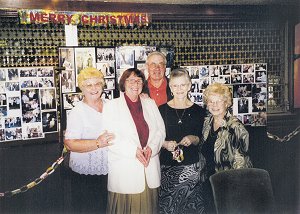 A group pose after decorating the lounge with paper chains