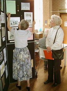 Sandra Aston demonstrates to another member the layout for hopscotch